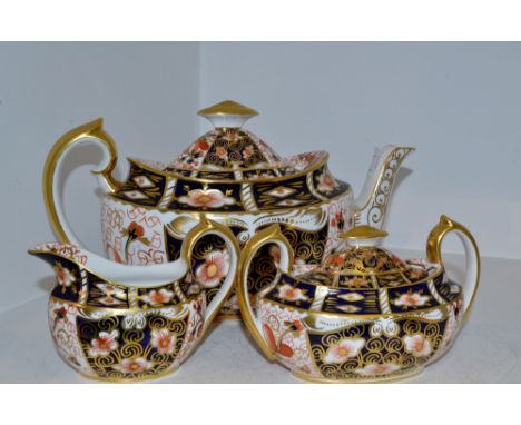 A Royal Crown Derby 2451 pattern teapot, cream jug and sucrier
