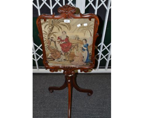 A Victorian style tapestry pole screen, panel embroidered with a biblical scene 