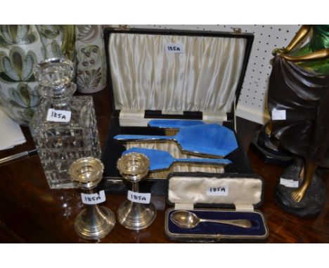 A pair of silver candlesticks London 1927; a cut glass decanter; a cased dressing table set, blue guilloche enamel;  etc 