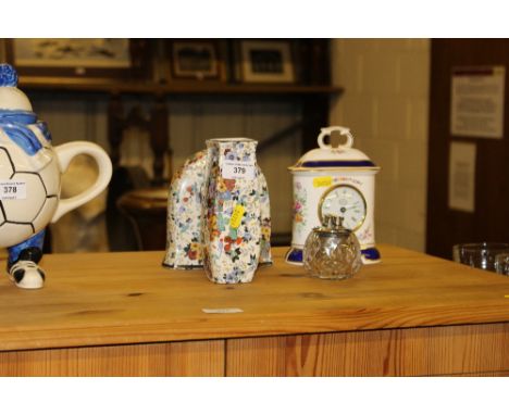 A Minton porcelain cased mantel clock; one other mantel clock with matching vase and a table lighter