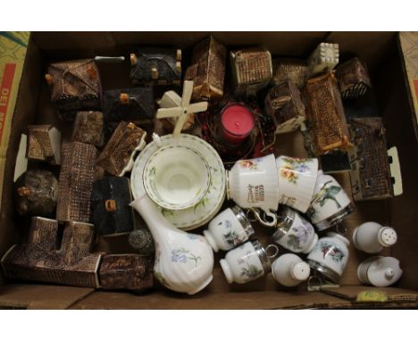 A box containing model cottages; Royal Worcester egg coddlers etc.