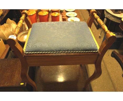 A satin wood piano stool with floral upholstery, makers label to inside lid