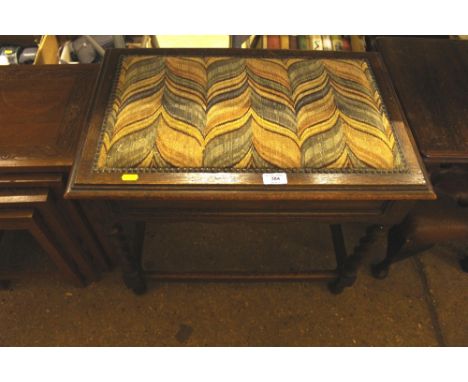 A 1930's oak barley twist piano stool