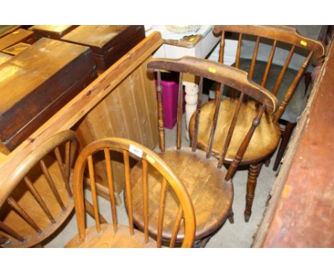 A pair of light Ercol elm stick back kitchen chairs; together with a pair of Ibex stick back kitchen chairs 