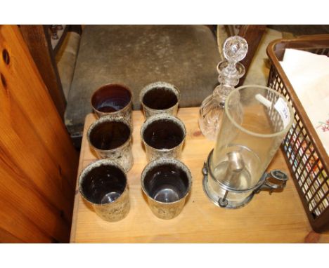 A glass licqueur decanter and stopper; a 19th Century silver plated chamber stick; and a set of six pottery goblets