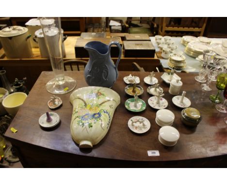A large glass vase; a quantity of china ring stands; trinket boxes; and a wall pocket 