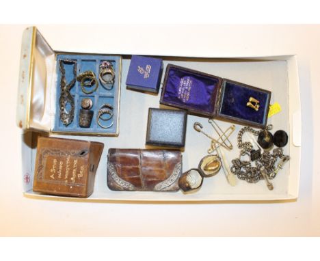 A tray containing a silver mounted and leather coin purse; various dress rings; a Victorian yellow metal mounted memorial bro