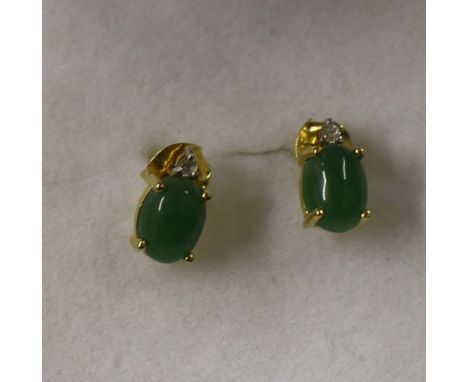 A pair of Sterling silver and 14ct gold overlaid jade and Cambodian Ziron era-rings