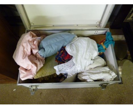 A large trunk of various cushions, textiles etc.