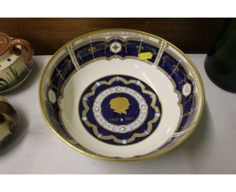 A Royal Worcester commemorative bowl; and two Royal Worcester plates 