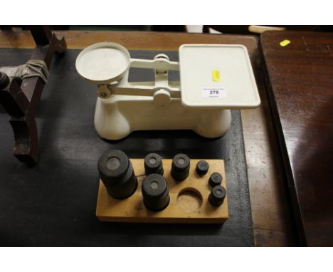 A set of white painted scales and weights