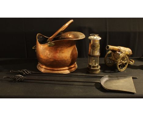 A copper cauldron shaped coal scuttle; a miner's lamp, E Thomas and Williams, Cambrian No.67991, Wales, Aberdare; a brass and