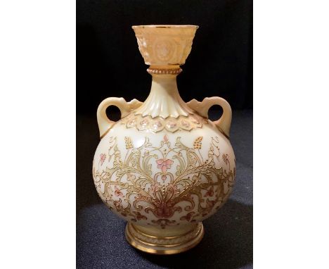 A Royal Worcester ovoid vase, in blush ivory, decorated in gilt and pink with scrolling foliage, 16.5cm high, crown and circl