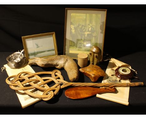 A soapstone tribal style bust, 17cm; a mahogany tribal paddle, 30cm; a piece of driftwood; a piece of resin; a carpet beater;