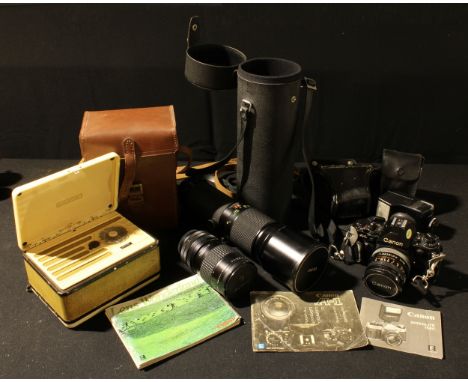 A Canon A1 CAMERA, 1939735;  a Hoya 62mm Skylight lens;  a Vivitar 400mm auto telephoto lens;  a Marconiphone radio, in case 