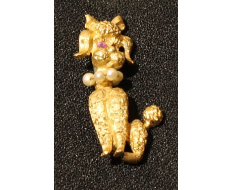 A 14k gold novelty poodle brooch, with ruby chip eyes and seed pearl collar, 3.5cm, 6.7g 