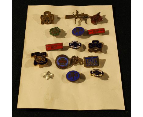 A collection of sixteen Girl Guide brooches and Baden Powell enamel badges 