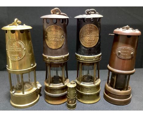 An Eccles Miners safety lamp;  a Hailwood &amp; Ackroyd Miners lamp;  another;  a Hockley lamp;  etc (5) 