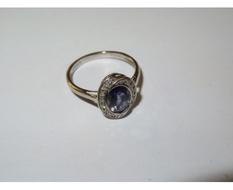 9ct White gold ring set with chip diamond &amp; central blue stone