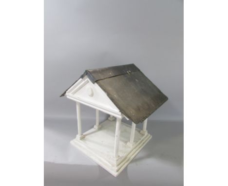 A vintage Portico bird table with a slate and lead roof. 31cm high 