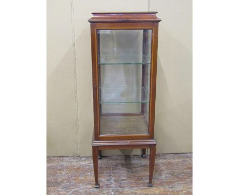 An inlaid Edwardian mahogany vitrine, of square cut form with glazed sides and shelves on square cut supports, 115cm high x 4