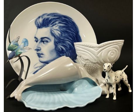 Two Nao figures with children and puppies, a Mozart commemorative plate, a Poole pottery shell, a slag glass vase etc