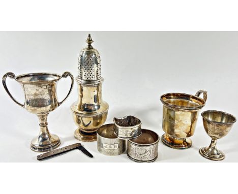 A mixed selection of silverware including a small Christening tankard, a sugar castor, a small trophy, an egg cup, pen knife 