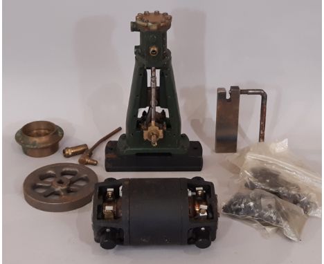 Vertical stationary steam engine partially assembled together with a boxed 32W rotary transformer dynamo 