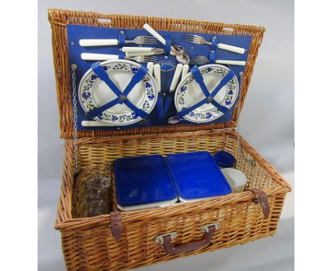 An Optima wicker picnic hamper with Churchill crockery with a floral border, tumblers, cutlery, sandwich boxes, thermos flask