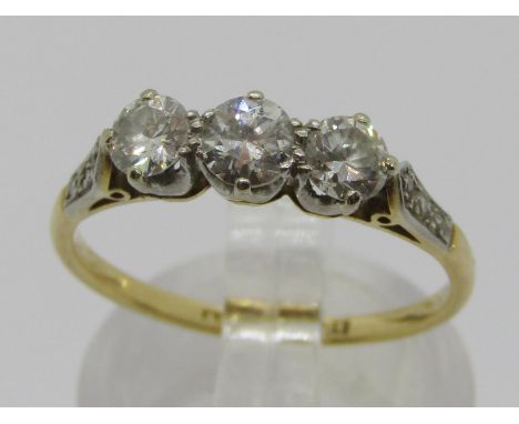 18ct three stone diamond ring with platinum setting, stones 0.20ct each approx, with further rose-cut diamonds to shoulders, 
