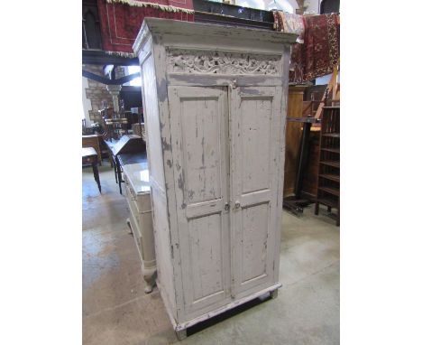 A vintage painted and distressed Eastern hardwood side cupboard freestanding and enclosed by a pair of three quarter length f