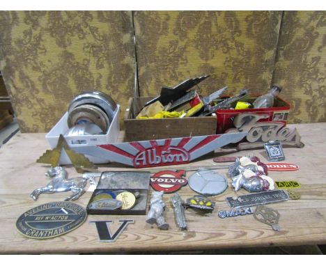 Automobilia interest - A collection of vintage lorry and car badges, hub caps, oil cans, etc