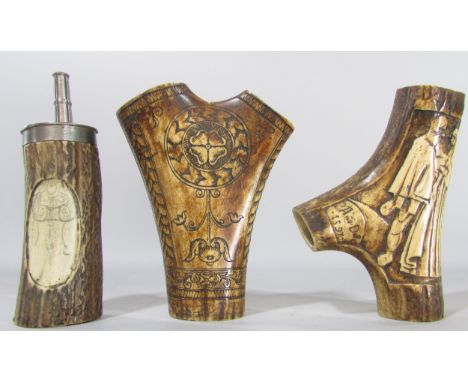 A scrimshaw decorated section of an antler, 14cm high, together with another engraved with a couple clasping each others hand
