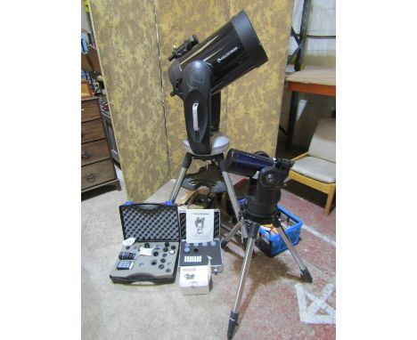 A Celestron CPC Series high power telescope with numerous accessories, instruction manual, etc, together with a 12v rechargea