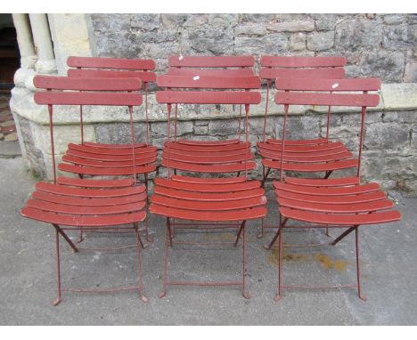 A set of six vintage folding garden chairs with painted slatted seats and iron frames 