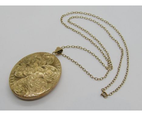 Large vintage 9ct locket with engraved scrolled and floral decoration, maker 'FBros', Birmingham 1973, 20g, hung from a long 