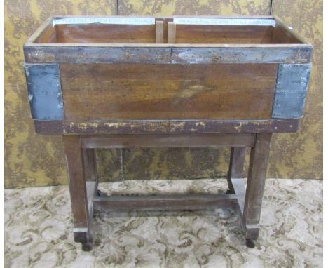 A vintage GPO (General Post Office) industrial sorting hopper, in banded pine on a wheeled trestle framework, with old labels