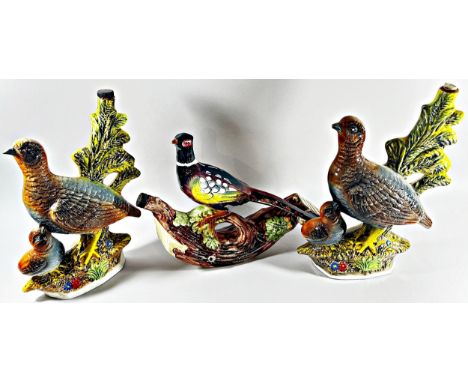 A collection of ten ceramic liqueur flasks by Garnier in the form of mainly game birds 