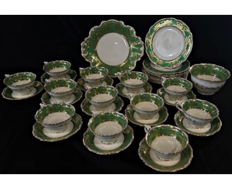 George Jones green and gilt china tea ware comprising 12 cups and saucers, 10 sandwich plates, shaped dish and basin