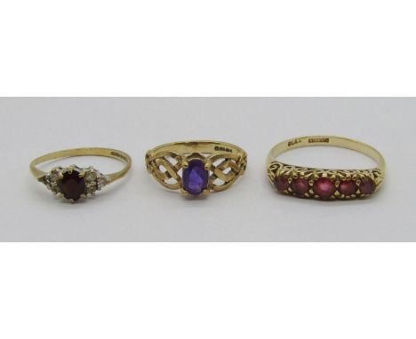 Three vintage 9ct gem set dress rings comprising a five stone ruby example, size Q, a Celtic style amethyst example and a gar