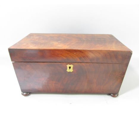 A Georgian mahogany tea caddy open to reveal two wooden caddies and a glass mixing bowl, ring handle and bun feet. 30.5cm x 1