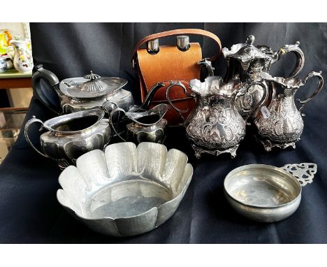 Two three-piece silver plated tea services, a pewter porringer bowl, a lightly hammered pewter fruit bowl, and a leather flas