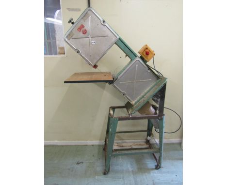 A Kity 612 bandsaw and stand 