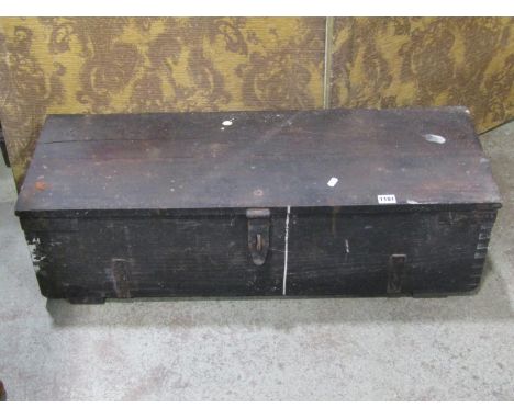 A vintage stained wooden tool chest containing a quantity of carpentry related hand tools 