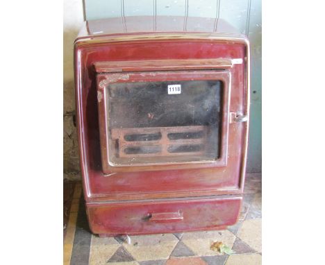 A cast iron and enamel Rayburn room heater 61 cm high x 45 cm wide x 34 cm deep 