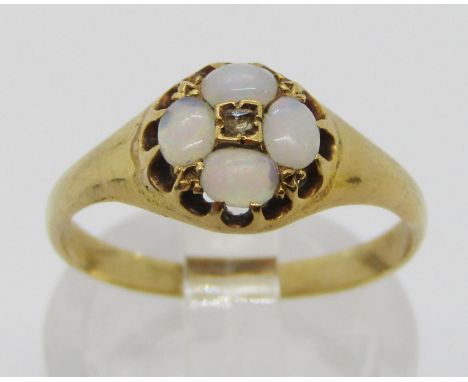 Victorian yellow metal opal and diamond quatrefoil cluster ring, set with four oval cabochon opals and a rose-cut diamond to 