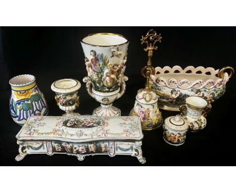 A collection of Capodimonte ware comprising trinket box and cover, urn shaped vase, house bell, vases etc. A further German f