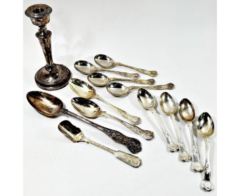A good quantity of loose King’s pattern flatware and a single silver candle stick. 