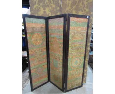 A vintage three fold freestanding screen , the stained oak frame enclosing postage stamp decorated panels each panel 168cm h 