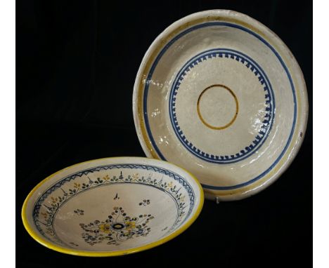Two Spanish pottery dishes with hand-painted floral and ring-banded detail, 35cm diameter maximum